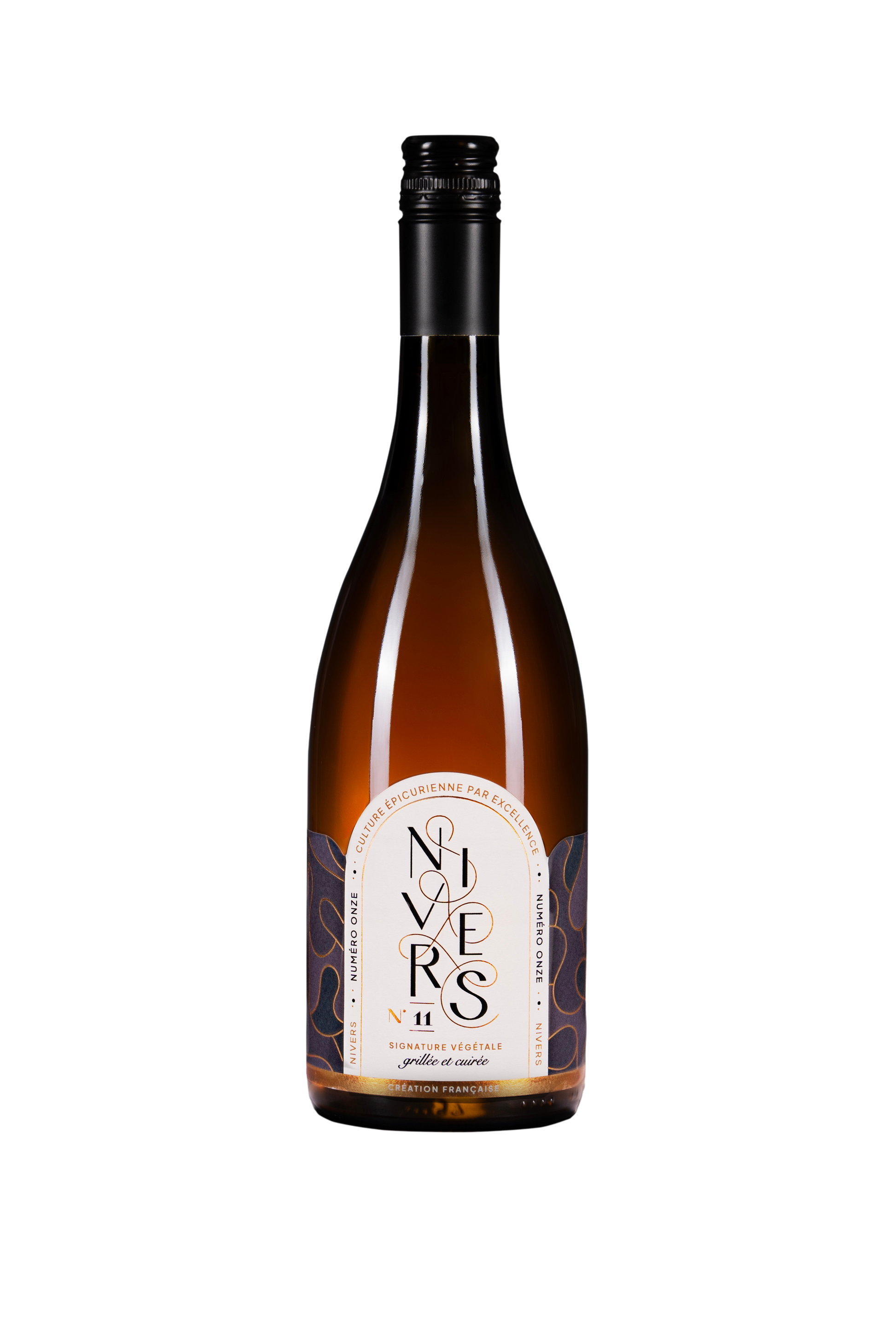 A bottle of Nieves No. 11  non-alcoholic cuvée of Grand Cru black tea, Japanese green tea, French Verjus, and Osmanthus flower. featuring an 750mL amber-brown glass bottle with a cream-colored label and a black screw cap, set against a plain white background.